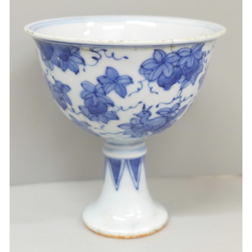 620 - A Chinese blue and white stem cup, four character mark to base, 10cm, a/f, hairline cracks to rim