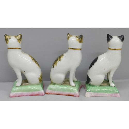 625 - Three small Victorian Staffordshire cats (2+1), 10cm