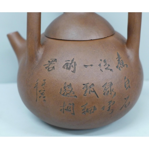 633 - A Chinese clay Yixing teapot, handle repaired
