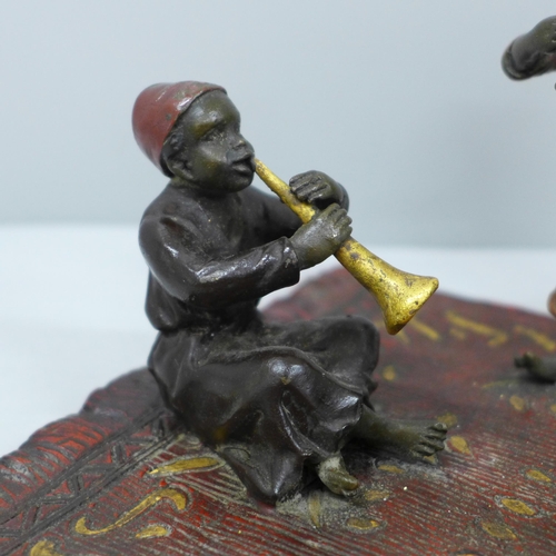 634 - After Bergman, a cold painted bronze of three musicians on a carpet, signed Namgreb to base, 16.5cm ... 
