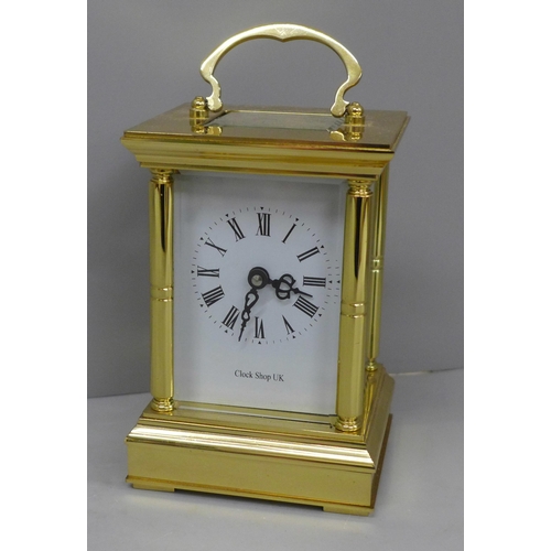 639 - A 20th Century solid brass four glass sided carriage clock, white enamel dial with Roman numerals, k... 