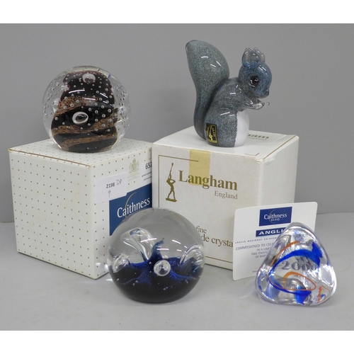 652 - A Langham glass squirrel, two Caithness paperweights, Moonflower and Gold Rush and a Caithness Mille... 