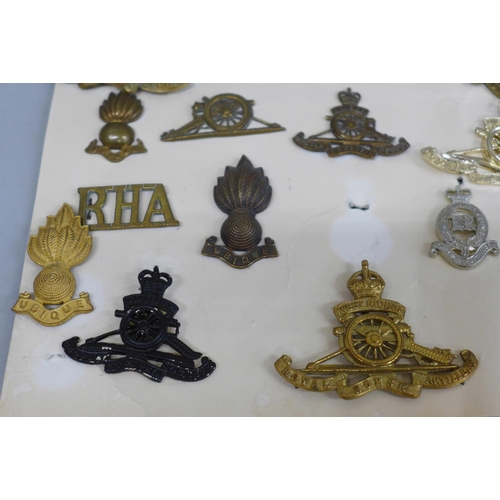 656 - A collection of Royal Artillery cap badges