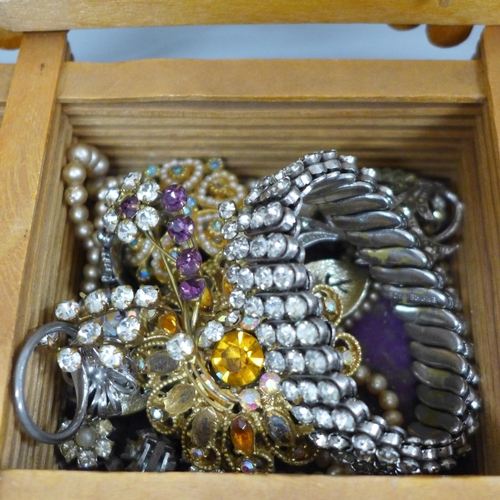 664 - A box and bag of vintage costume jewellery