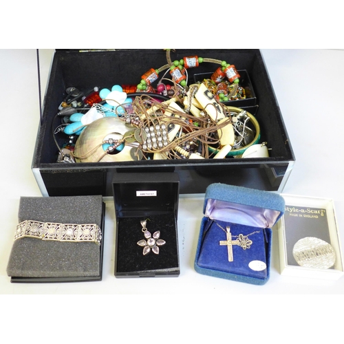 674 - A box of costume jewellery including a silver cross and chain