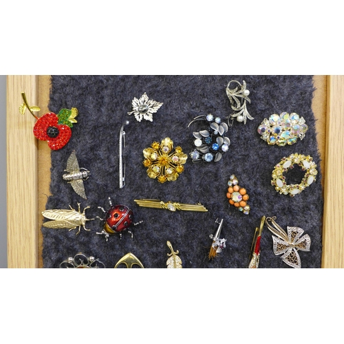 681 - Twenty-five costume brooches