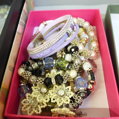 711 - A box containing 55 necklaces, a pendant, lady's wristwatches, owl brooches and a pendant watch