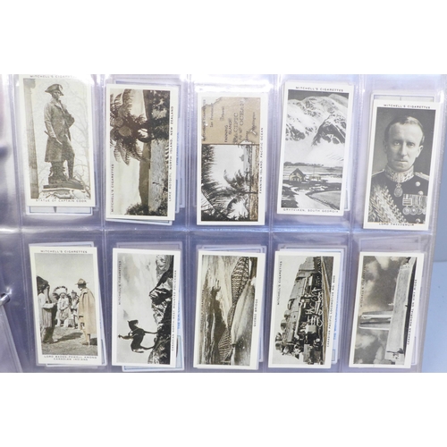 712C - Cigarette cards; an album of twelve complete sets of cigarette cards including Players Regimental Un... 