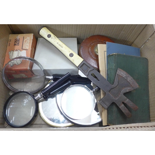 725 - A German pallet axe, a War issue surveyor's tape measure, a Handbook of Signalling, 1913, other pamp... 