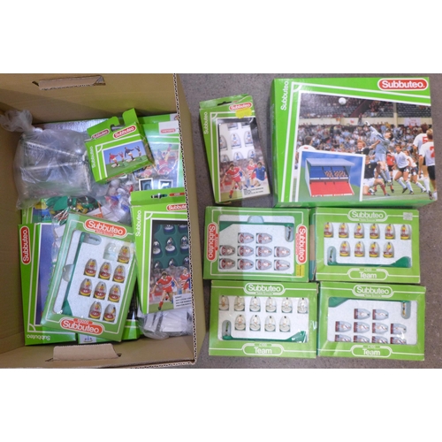 740 - A collection of Subbuteo sets and a stadium, accessories and teams including Queens Park Rangers and... 