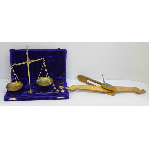 756 - A set of balance scales and weights and a gilt brass section of balance scales