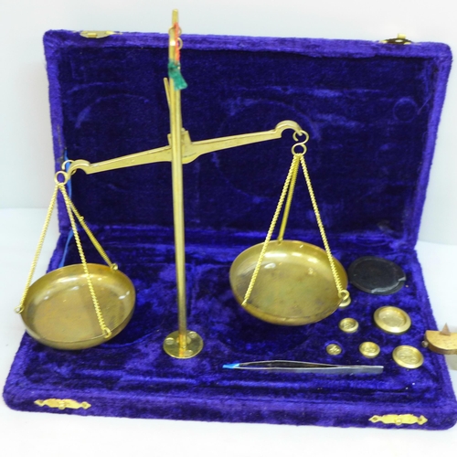 756 - A set of balance scales and weights and a gilt brass section of balance scales