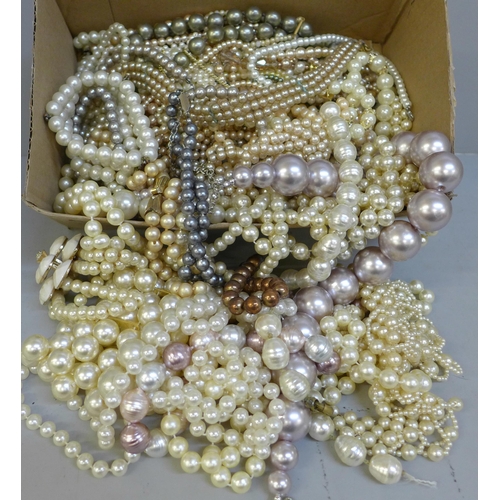 761 - A box of faux pearl necklets and bracelets