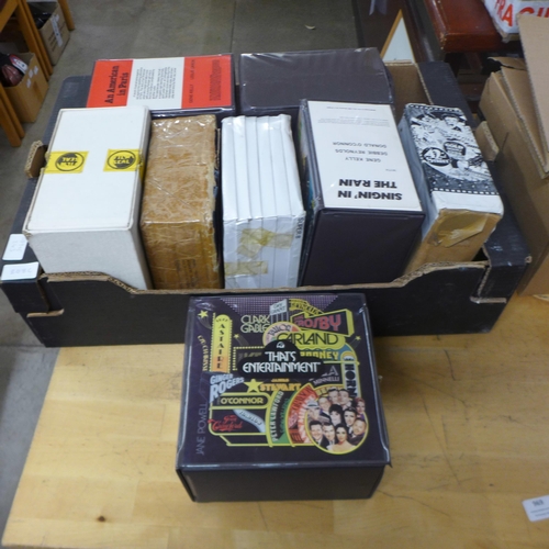 808C - A box of Super 8 film reels, That's Entertainment, An American in Paris, Singin' In The Rain, etc., ... 