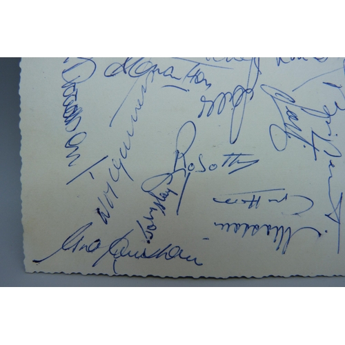 857 - Football autographs, England a black and white postcard showing the England team that played Italy a... 