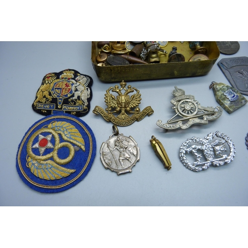 858 - A WWI Princess Mary Christmas tin with a collection of badges, buttons, etc.