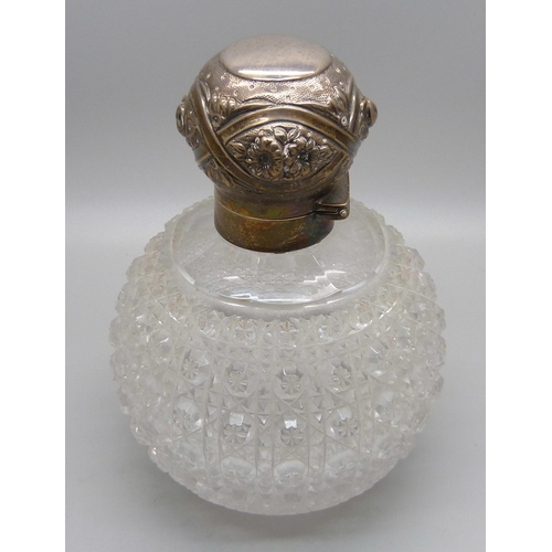 870 - A Victorian silver globular cut glass perfume bottle, London 1892, marked Mappin & Webb, 13cm, with ... 