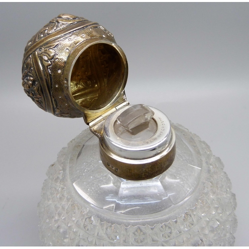 870 - A Victorian silver globular cut glass perfume bottle, London 1892, marked Mappin & Webb, 13cm, with ... 