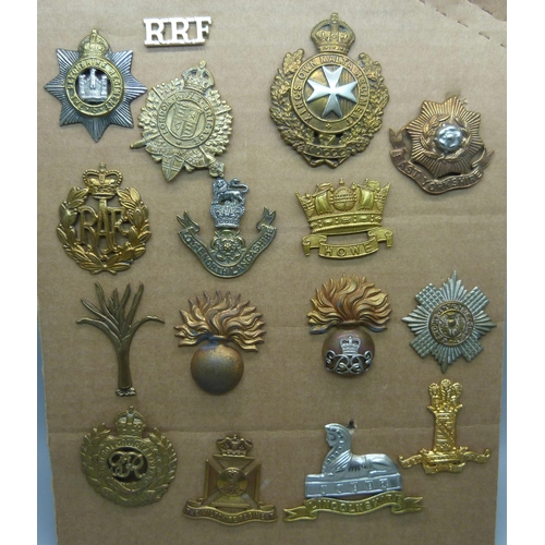 877 - Fifteen military regimental badges including Wiltshire Regiment, King's Own Malta Regiment and The D... 