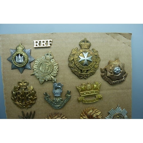 877 - Fifteen military regimental badges including Wiltshire Regiment, King's Own Malta Regiment and The D... 