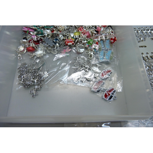 881 - A collection of forty bracelets and a large collection of novelty charms