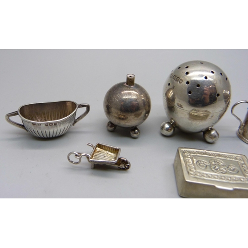 883 - A small hallmarked silver pepper, a hallmarked silver miniature sugar bowl, a miniature 925 silver s... 