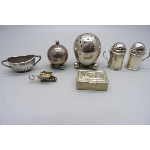 883 - A small hallmarked silver pepper, a hallmarked silver miniature sugar bowl, a miniature 925 silver s... 