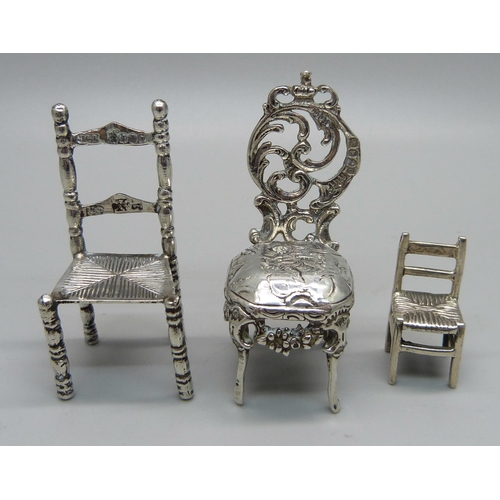 884 - Two miniature silver model chairs with London import marks, 1897 and 1902, and a smaller 925 silver ... 