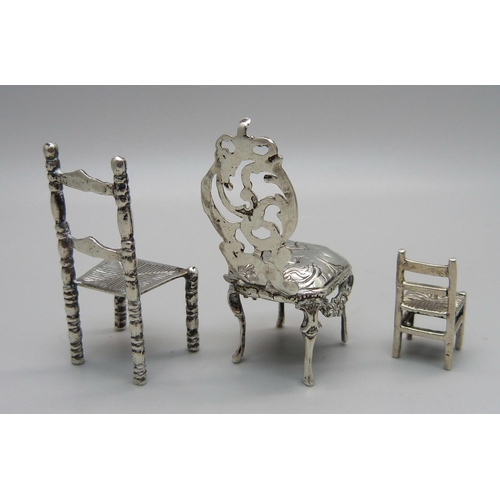 884 - Two miniature silver model chairs with London import marks, 1897 and 1902, and a smaller 925 silver ... 