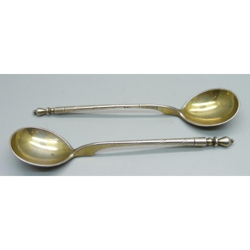 892 - A pair of Russian 84 silver spoons, marked 1858, 50g