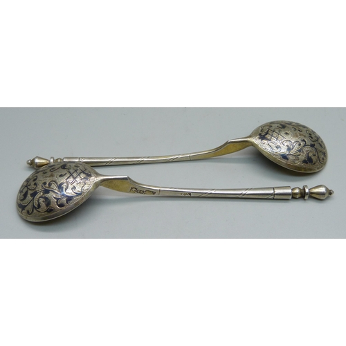 892 - A pair of Russian 84 silver spoons, marked 1858, 50g