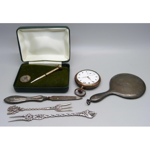 893 - A small silver hand mirror, an 800 silver pocket watch, lacking glass, a silver golf tee pencil and ... 