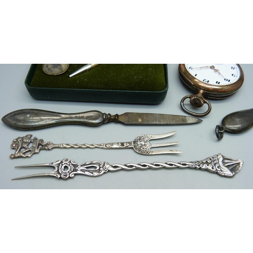 893 - A small silver hand mirror, an 800 silver pocket watch, lacking glass, a silver golf tee pencil and ... 