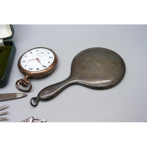 893 - A small silver hand mirror, an 800 silver pocket watch, lacking glass, a silver golf tee pencil and ... 