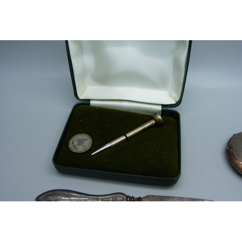 893 - A small silver hand mirror, an 800 silver pocket watch, lacking glass, a silver golf tee pencil and ... 