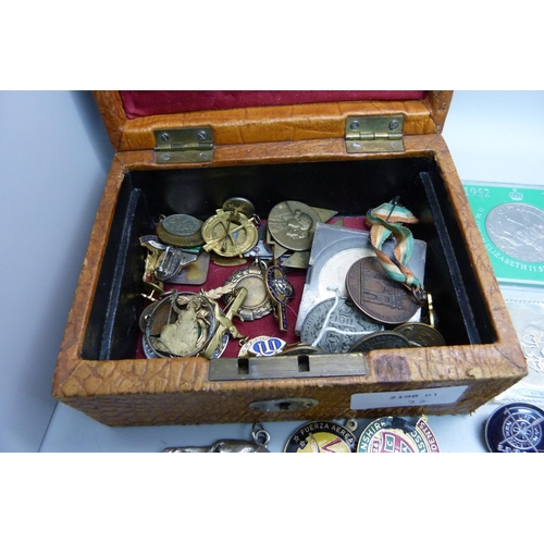 906 - A leather jewellery box containing coins, medallions, badges, etc., (replica 8 Reales coin)