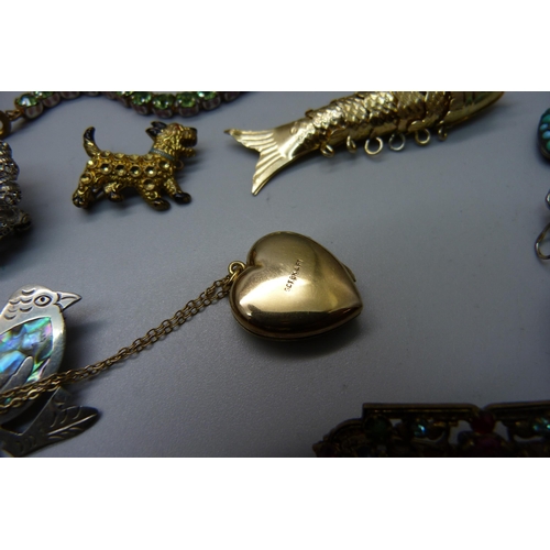 911 - Vintage and other jewellery including some silver, a gold back and front locket, brooches including ... 