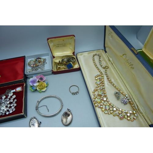 916 - A collection of costume jewellery including a silver cocktail wristwatch head, and a plated box