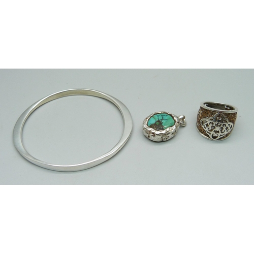 942 - A hallmarked silver bangle, a turquoise pendant, (tests as silver) and a ring, O, (tests as silver a... 
