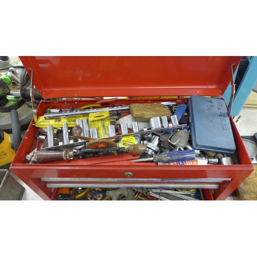 2032 - A red metal toolbox with sliding drawers including a quantity of mixed tools including sockets, scre... 