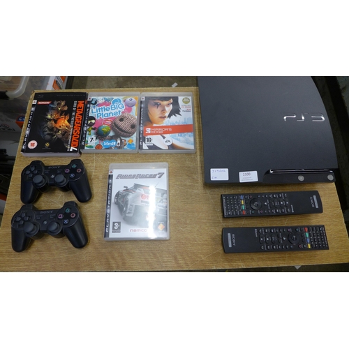 2100 - A Sony Playstation 3 with controller and remote with box