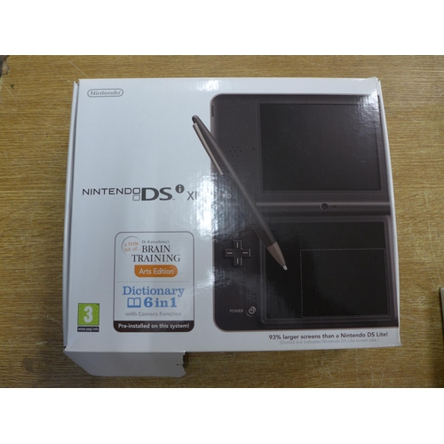 2103 - A Nintendo DS XL hand held gaming console with one game - in box