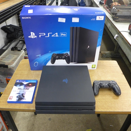 2106 - A Sony PlayStation 4 Pro 1TB Jet Black Console Computer with Kills zone shadow fall, remote and cabl... 