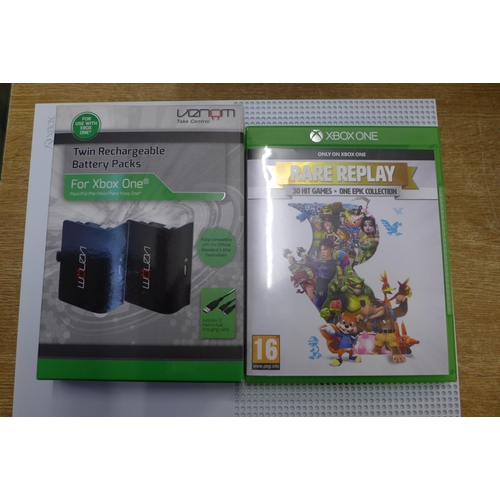 2107 - A Microsoft XBox One Console with two controllers and one game- in box