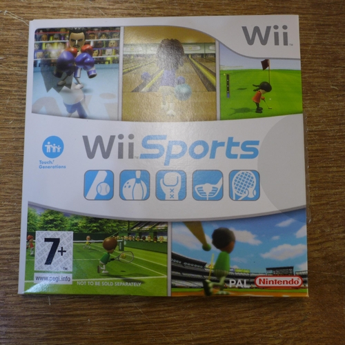 2117 - A Nintendo Wii gaming console with accessory's and 4 games- boxed