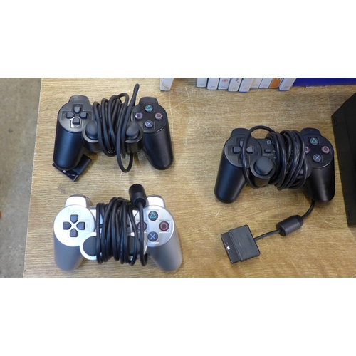 2118 - A Sony PlayStation 2 console with 3 controllers, memory card and 10 games - boxed