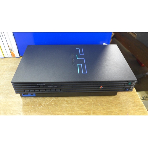 2118 - A Sony PlayStation 2 console with 3 controllers, memory card and 10 games - boxed