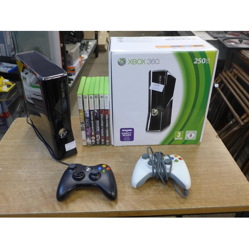 2119 - A Microsoft Xbox 360S gaming console with two remotes and 7 games - in box