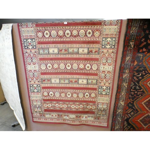 1523 - A rich red ground Kashan rug with bespoke all-over design (170cm x 120cm)