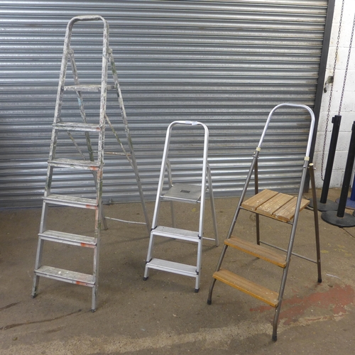 2220 - Two sets of 3-rung stepladders and a set of 6-rung stepladders